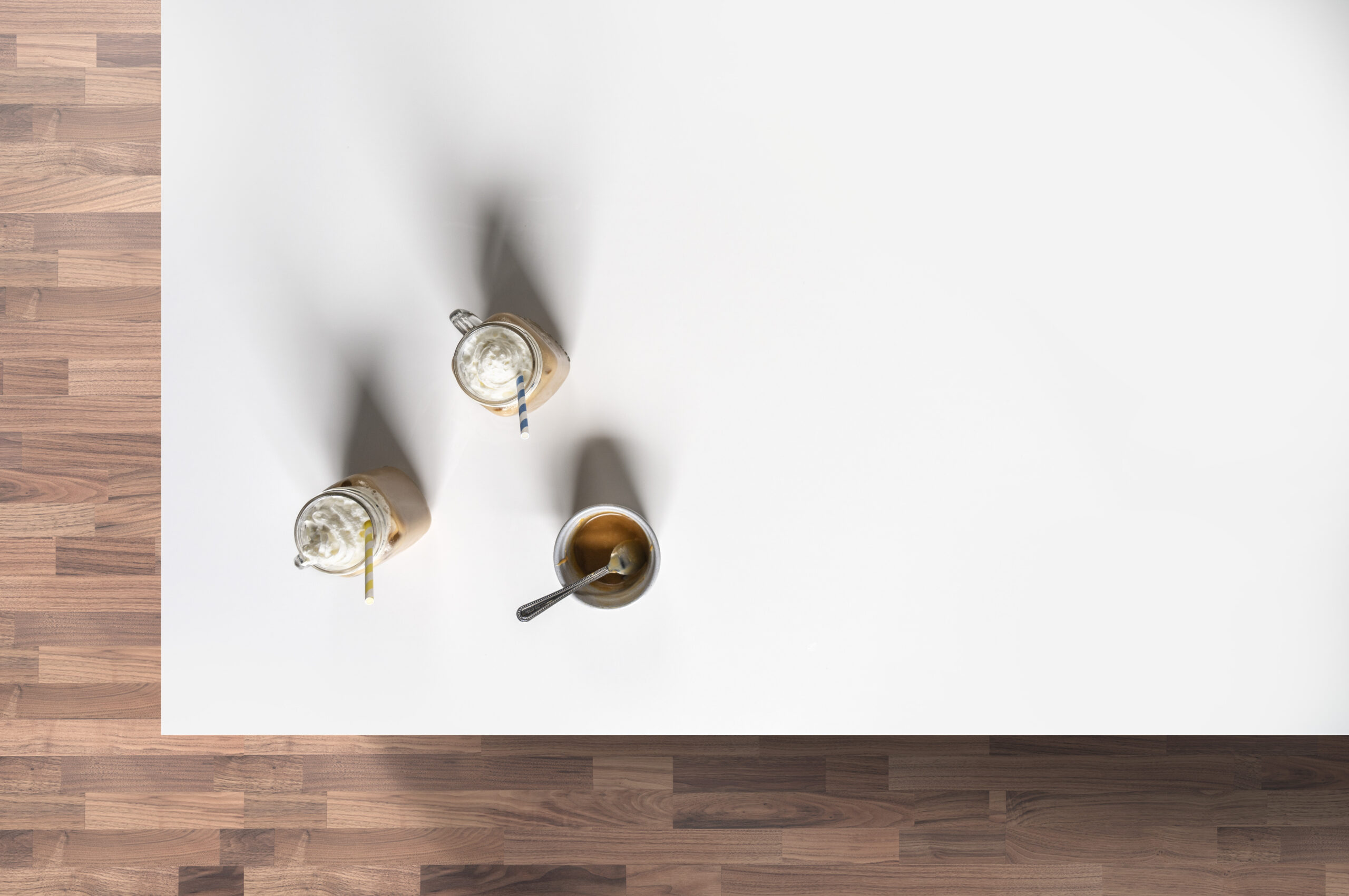 White Thasos Porcelain worktop surface with three core-drilled tap holes, shown on a workshop bench ready for fitting