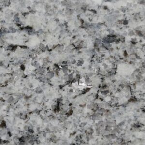 Close up slab photo of Azul Platino Granite showing a light grey base with black and silver crystal flecks and a fine natural grain.