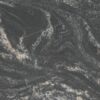 Close up slab photo of Black Storm Granite showing dramatic swirling veining and natural movement in dark tones.