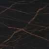 Laurent Porcelain surface detail showing dark porcelain with warm gold veining running diagonally across the worktop.