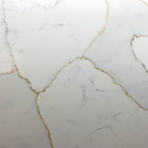 Close up of Gold Calacatta worktop surface showing warm natural veining