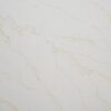 Close-up of Gold Statuario Quartz slab showing fine gold veining on a bright white polished surface