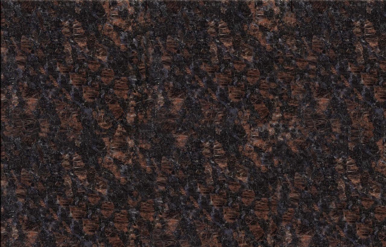 Close up slab photo of Tan Brown Granite showing a dense brown and black crystal pattern with warm copper tones across the surface.