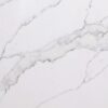 White Calacatta Quartz surface showing bold grey veining on a bright white background