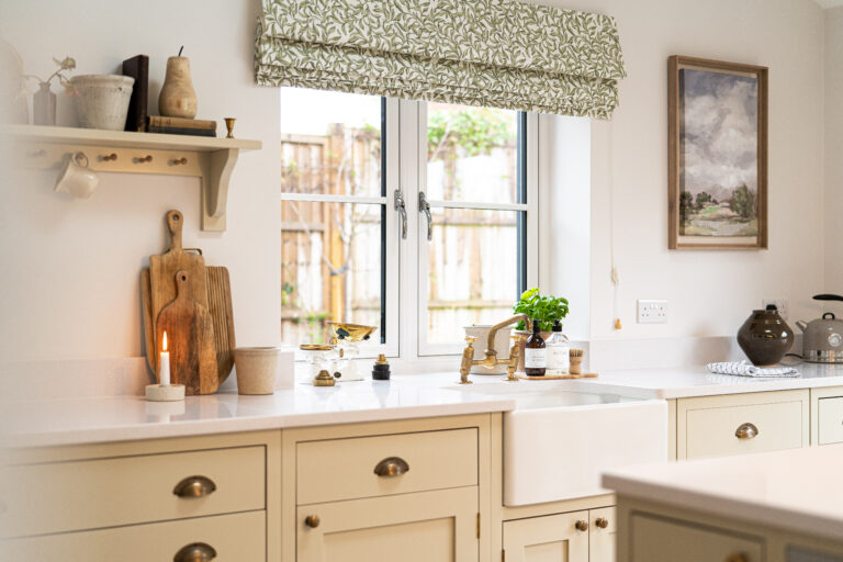 Light kitchen with Ice White Quartz worktops around the sink area and a smooth white surface finish