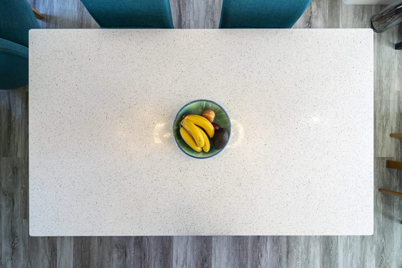 White Starlight Quartz worktop surface styled with fruit in a bright kitchen setting