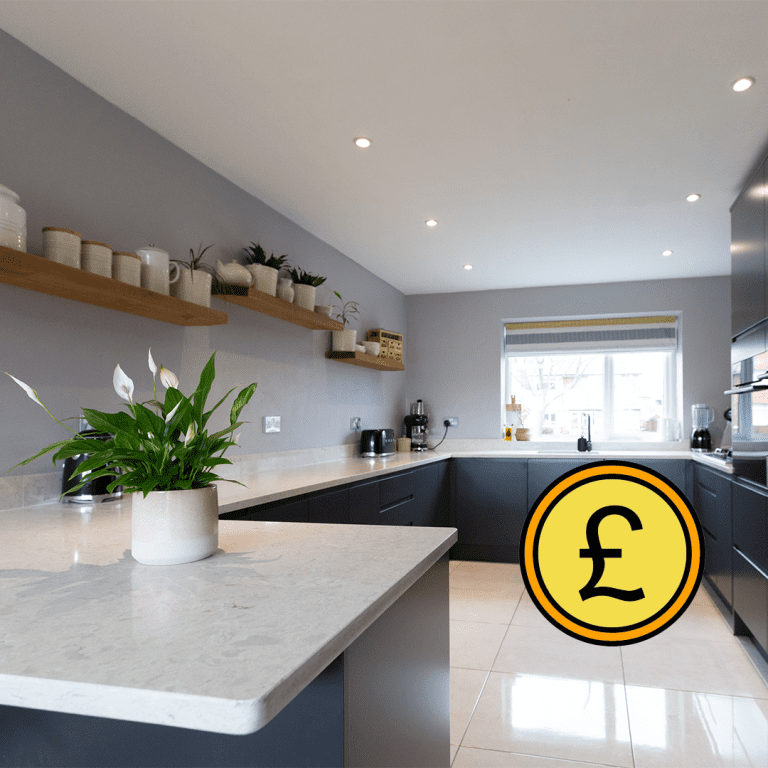 Grey Drift Quartz peninsula worktop with clean edge detail and pale stone-effect pattern in a modern kitchen